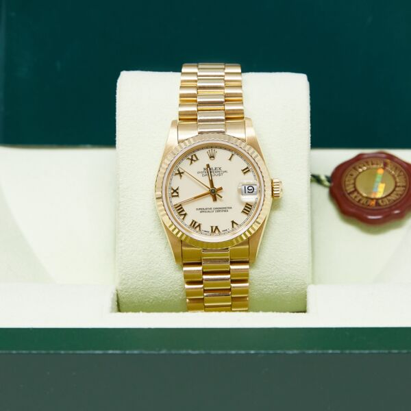 Rolex Pre-Owned Datejust 31 Yellow Gold White Roman Dial on Presidential Bracelet